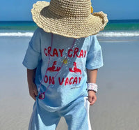 Kid wearing a terry cloth pants clothing set while on the beach