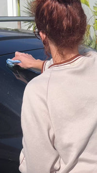 Video of a mum putting on a car sticker for family