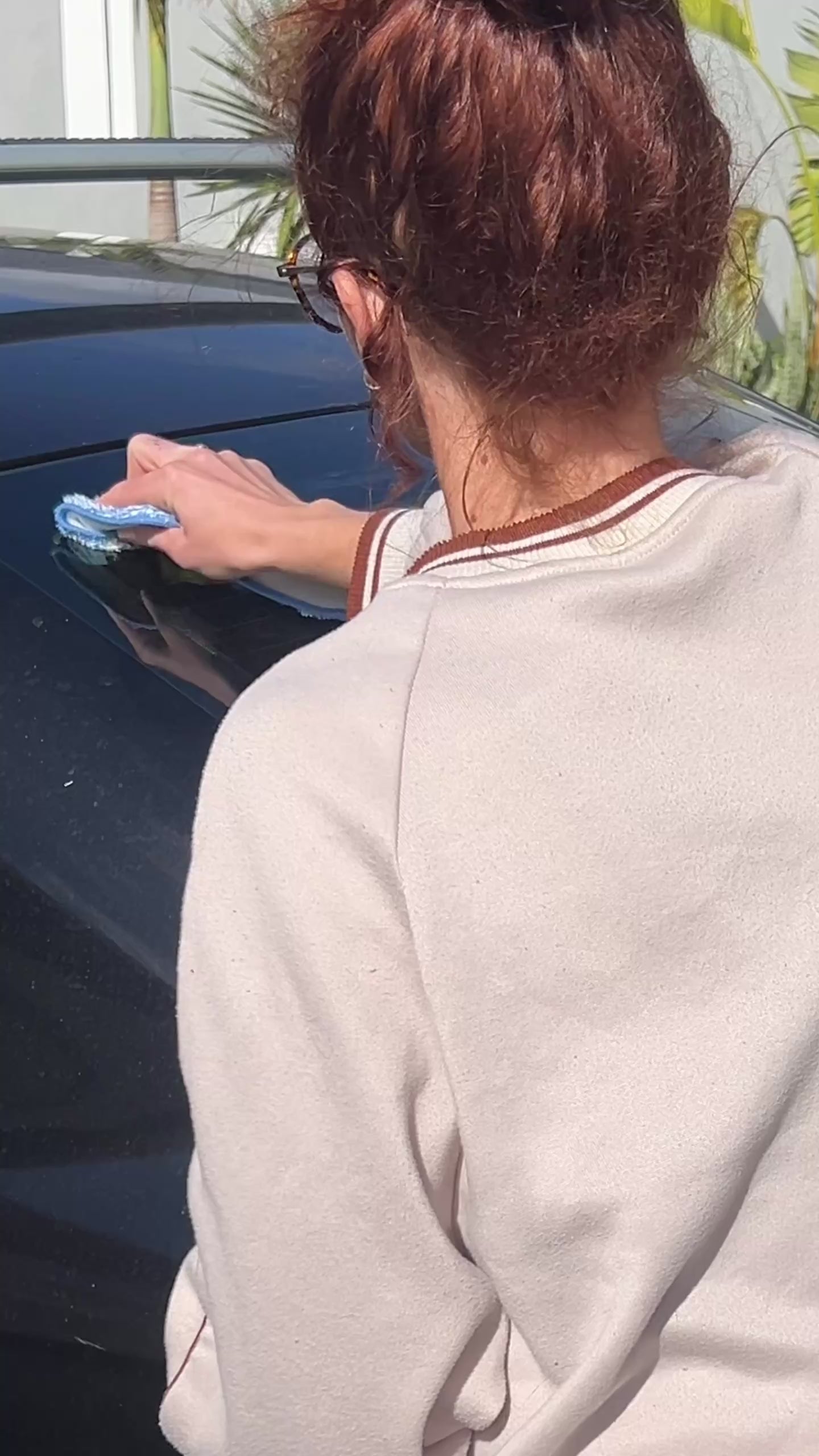 Video of a mum putting on a car sticker for family