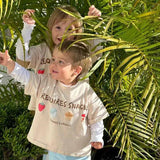 Two sibling children in matching graphic beige t-shirts australia