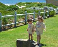 Child wearing Barefoot Bandit kids terry towelling shirt in soft cotton, Australian coastal kidswear by Compass & Cradle.
