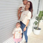 Mum and two children wearing matching t-shirts