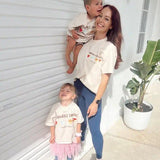 Mum and two children wearing matching t-shirts
