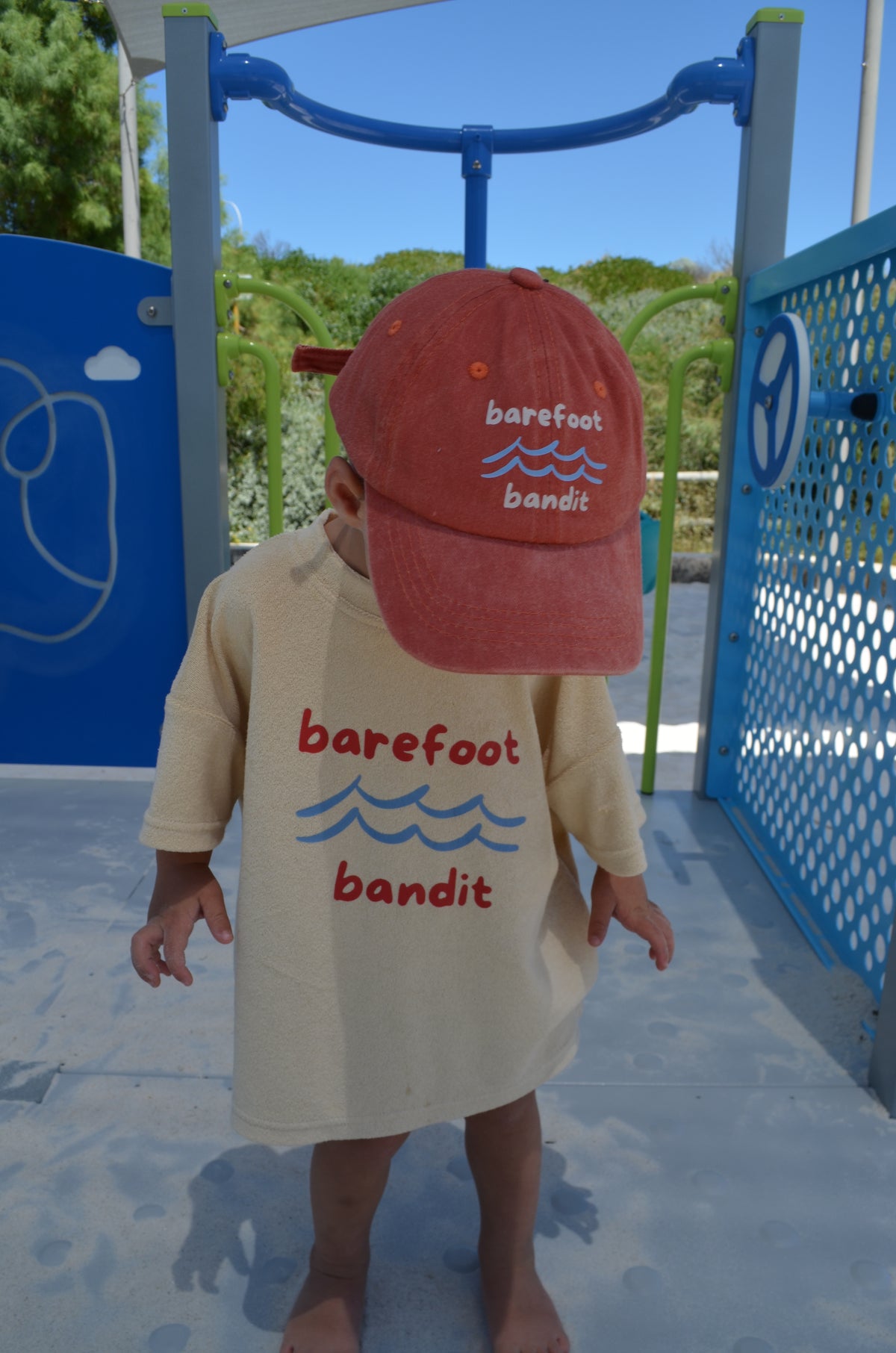 Child wearing Barefoot Bandit kids terry towelling shirt in soft cotton, Australian coastal kidswear by Compass & Cradle.